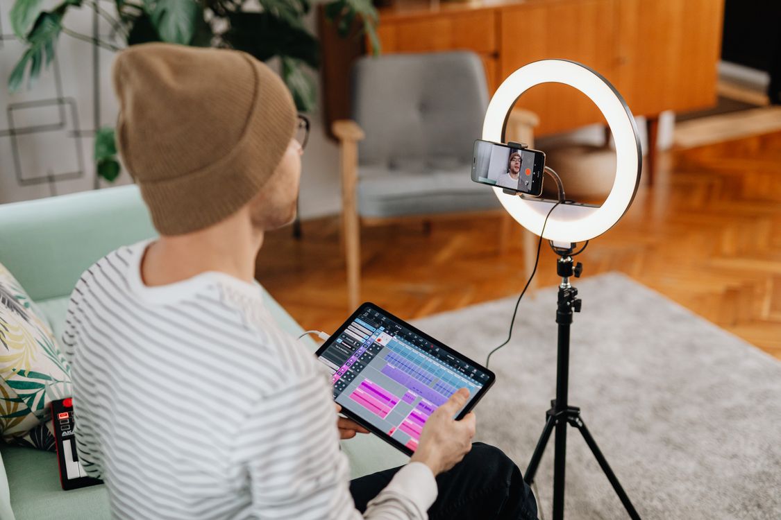 A creator recording from his home studio